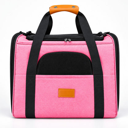 Katzentransporttasche in Rosa mit schwarzen Tragegriffen und orangefarbenem Griff
